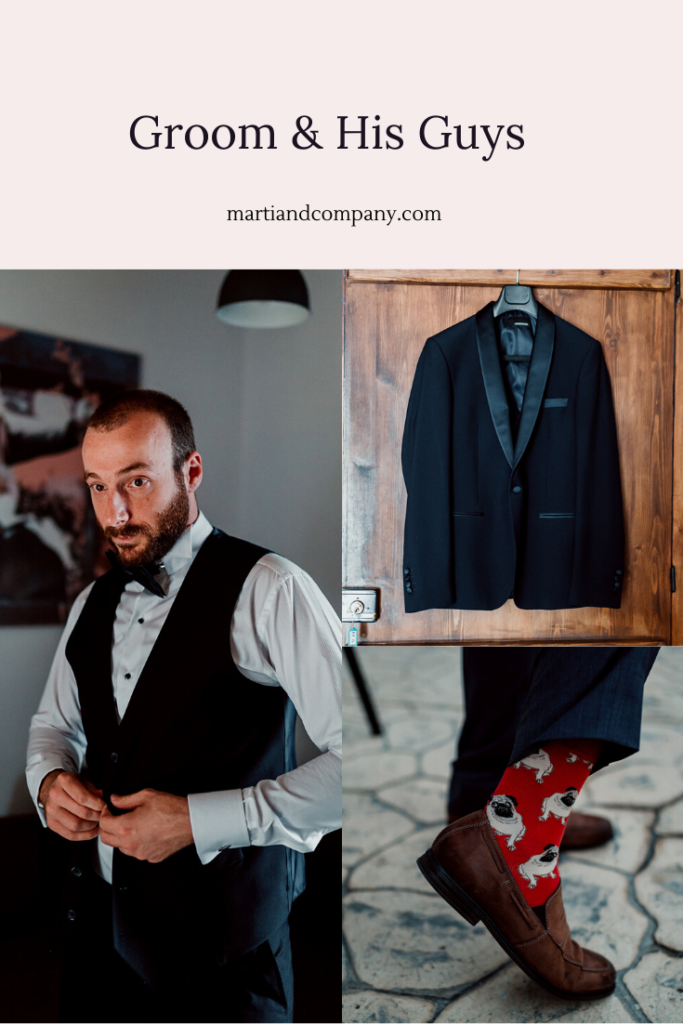groom getting dressed in a navy suit