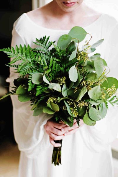 Bride holding greenery wedding bouquet