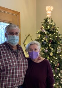 couple with face masks at Christmas