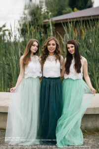 Bridesmaids in green 2 piece outfits
