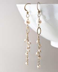 long pearl and gold earrings