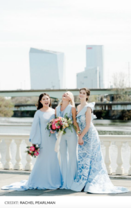 3 bridesmaids in light blue dresses and a jumpsuit
