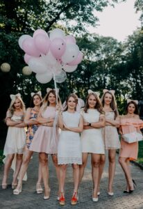 photo of bridal party holding balloons by Zoriana Stakhniv on Unsplash