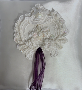 satin ring pillow with lace appliqués
