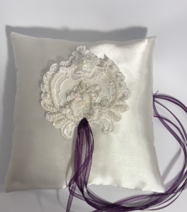 white satin ring pillow with lace appliqué