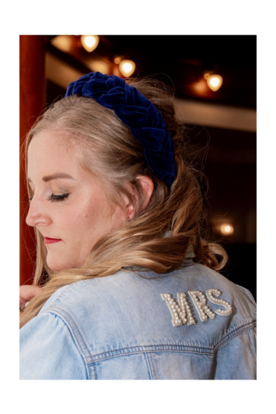 bride wearing a MRS denim jacket & a navy blue headband - Eclectic Bridal Style