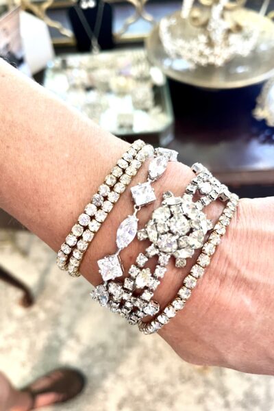 Women wearing a mix of vintage and modern rhinestone bracelets 5 Tips Youâ€™re sure to love for an Unforgettable Elopement Look