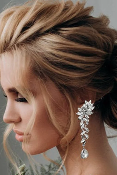 woman wearing sparkly bridal earrings