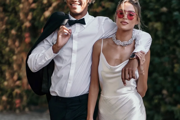 bridal couple walking, bride wearing rose colored square sunglasses