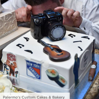 photo of grooms cake white with hobby icons