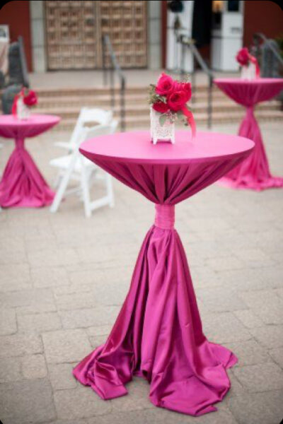 cocktail table with a magenta table covering