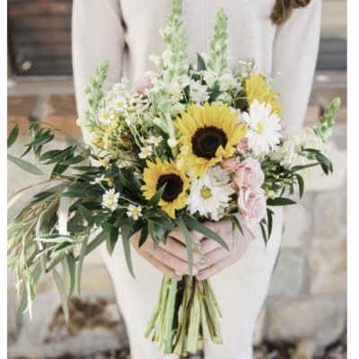Bride holding a sunflower bouquet