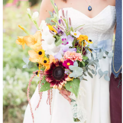 photo of bride with sunflower bouquet via Martha Stewart blog