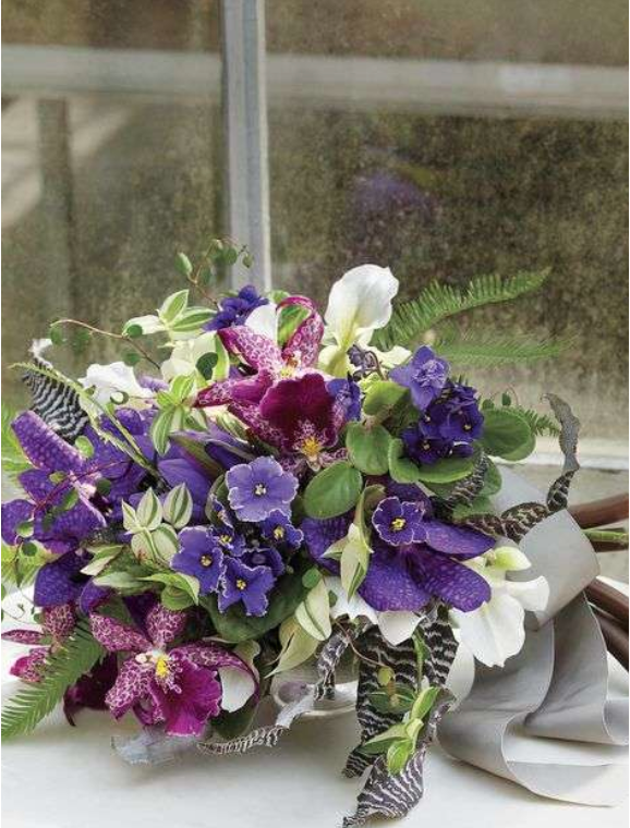 bridal bouquet of violets and other purple flowers