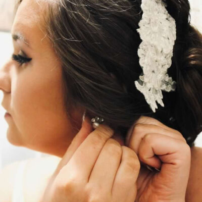 Bride wearing lace hair comb